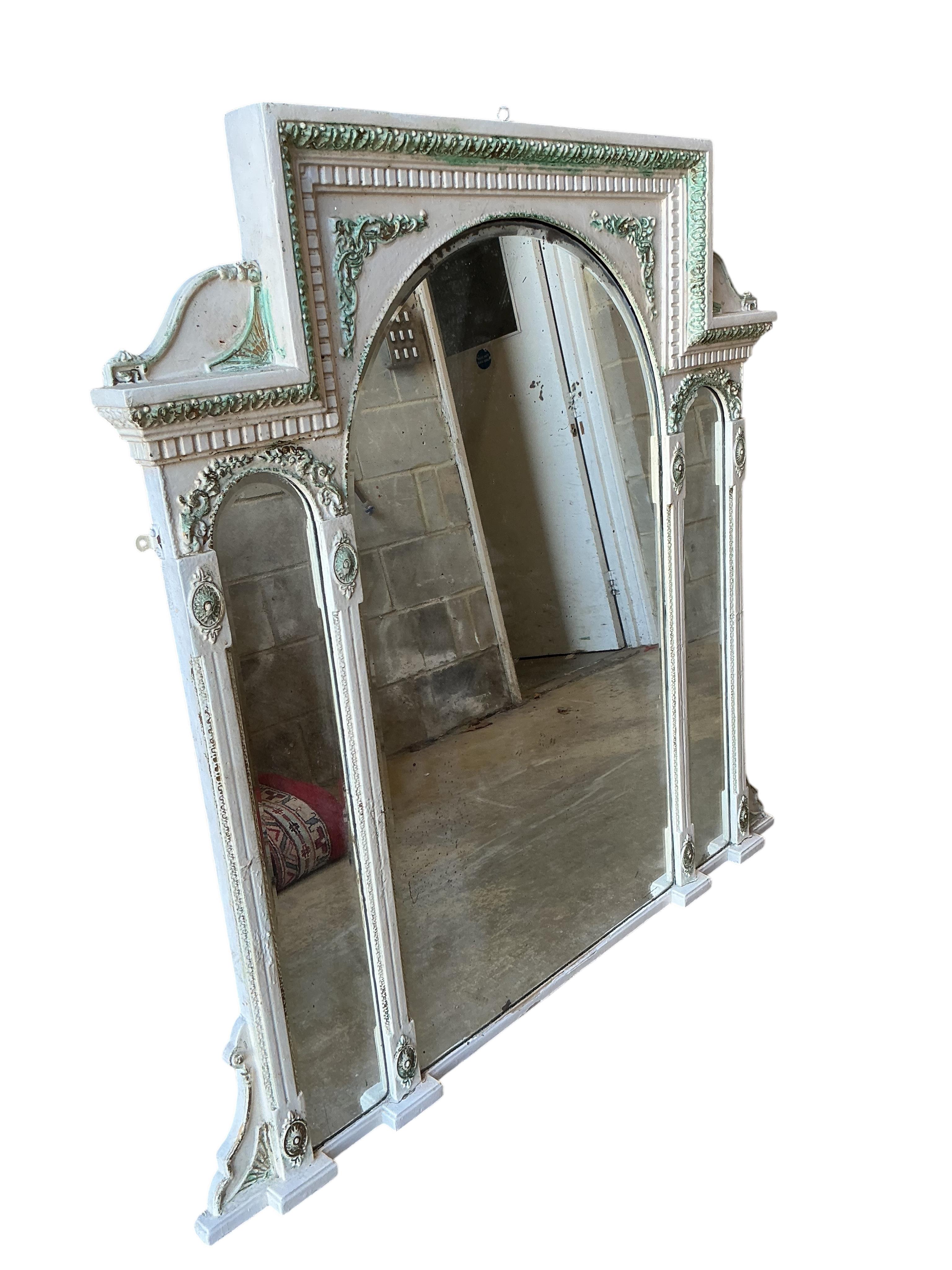 A Victorian overmantel mirror, later painted, width 116cm, height 123cm.